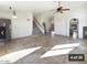 Bright living room with high ceilings and staircase at 5249 E Hobart St, Mesa, AZ 85205