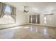 Inviting living room with tile flooring, natural light, and elegant window treatments at 5249 E Hobart St, Mesa, AZ 85205