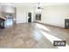 Open living area with tile floors and pool access at 5249 E Hobart St, Mesa, AZ 85205