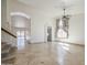 Open living area with tile floors, arched doorways, and a view to the backyard pool at 5249 E Hobart St, Mesa, AZ 85205