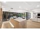 Bright kitchen with island, marble countertops, stainless steel sink, and an open floor plan at 7151 E Rancho Vista Dr # 5001, Scottsdale, AZ 85251