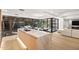 Open-concept kitchen with island, marble countertops, stainless steel sink, and views to dining area and living room at 7151 E Rancho Vista Dr # 5001, Scottsdale, AZ 85251