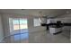 Open-concept living area and kitchen with luxurious floors and modern fixtures at 38720 W Sherman St, Tonopah, AZ 85354