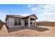 Spacious backyard with a covered patio at 7620 W Minton St, Laveen, AZ 85339
