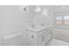 Bathroom features double sinks with modern lighting and mirrors at 7620 W Minton St, Laveen, AZ 85339