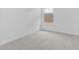 Cozy bedroom with neutral carpet and a window with natural light at 7620 W Minton St, Laveen, AZ 85339