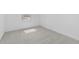 Bright bedroom with neutral carpet and a street view window at 7620 W Minton St, Laveen, AZ 85339