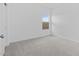 Cozy bedroom with neutral carpet and a window with natural light at 7620 W Minton St, Laveen, AZ 85339