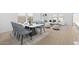 Open concept dining area with seating and living room in the background, lots of light at 7620 W Minton St, Laveen, AZ 85339