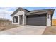 Charming home with a gray garage door and accent shutters at 7620 W Minton St, Laveen, AZ 85339