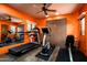 Home gym featuring modern exercise equipment, wood floors, and an open window offering scenic outdoor views at 42035 N 113Th Way, Scottsdale, AZ 85262