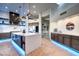 Stylish kitchen with an island, custom cabinets, and modern appliances at 42035 N 113Th Way, Scottsdale, AZ 85262