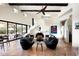 Bright living room featuring high ceilings, a unique fireplace, and seamless indoor-outdoor flow at 42035 N 113Th Way, Scottsdale, AZ 85262