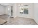 Bright dining area with tile floors, modern lighting fixture, and a large window at 901 S Smith Rd # 1012, Tempe, AZ 85281