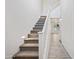 Carpeted stairway leading to the upper level of the home at 901 S Smith Rd # 1012, Tempe, AZ 85281