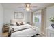 Comfortable bedroom with a queen-size bed, neutral decor, and large window at 7668 E Pleasant Run --, Scottsdale, AZ 85258