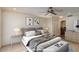 Spacious main bedroom with a large bed, neutral decor, and ensuite bathroom access at 7668 E Pleasant Run --, Scottsdale, AZ 85258