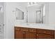 Bathroom with vanity, mirror, and wood cabinets at 691 E Elgin St, Gilbert, AZ 85295