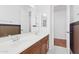 Elegant bathroom with double sinks and wood cabinets at 691 E Elgin St, Gilbert, AZ 85295