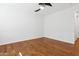 Well-lit bedroom with hardwood floors and ceiling fan at 691 E Elgin St, Gilbert, AZ 85295