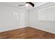 Bedroom featuring hardwood floors, window blinds, and arched windows at 691 E Elgin St, Gilbert, AZ 85295