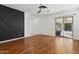 Bonus room with wood floors, sliding door to patio, and accent wall at 691 E Elgin St, Gilbert, AZ 85295