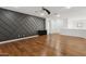 Bonus room with wood floors and a dramatic geometric wall at 691 E Elgin St, Gilbert, AZ 85295