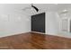 Bonus room with wood floors, an accent wall, and a ceiling fan at 691 E Elgin St, Gilbert, AZ 85295