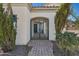 Elegant wrought-iron entry gate opens to a brick paved walkway at 691 E Elgin St, Gilbert, AZ 85295