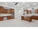 Modern kitchen with wood cabinets, large island, and tile flooring at 691 E Elgin St, Gilbert, AZ 85295