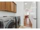 Laundry room with washer, dryer, and cabinets at 691 E Elgin St, Gilbert, AZ 85295