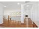 Upstairs hallway with wood floors and wrought-iron railing at 691 E Elgin St, Gilbert, AZ 85295