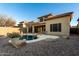 View of the backyard and pool, showcasing the outdoor living space and desert landscaping at 2140 W Clearview Trl, Anthem, AZ 85086