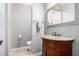 Charming powder room with an ornate wood vanity and granite countertop at 2140 W Clearview Trl, Anthem, AZ 85086