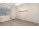 Neutral bedroom with a ceiling fan, carpet flooring, window, and closet at 2140 W Clearview Trl, Anthem, AZ 85086