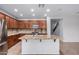 Large kitchen island featuring granite countertops complements the stainless appliances and modern design at 2140 W Clearview Trl, Anthem, AZ 85086