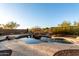 Beautiful pool and spa area with waterfall feature, stone accents and desert landscaping at 2140 W Clearview Trl, Anthem, AZ 85086