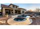 Inviting pool and spa with custom rock features and meticulously landscaped backyard at 2140 W Clearview Trl, Anthem, AZ 85086