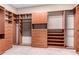 Walk-in closet with custom built in shelving, drawers, and ample storage at 2140 W Clearview Trl, Anthem, AZ 85086