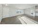 Bright and airy living room with wood-look flooring and large windows at 31812 N 221St Dr, Wittmann, AZ 85361