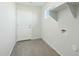 Mud room with wood-look tile floor, and a storage shelf at 31812 N 221St Dr, Wittmann, AZ 85361