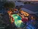 Evening view of a beautiful home with a pool and patio at 40903 N Harbour Town Way, Anthem, AZ 85086