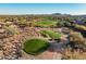 Community view showcasing homes, a golf course and mountain views at 40903 N Harbour Town Way, Anthem, AZ 85086