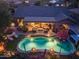 Night view of a home with a pool and spacious backyard at 40903 N Harbour Town Way, Anthem, AZ 85086