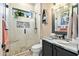 Spa-like bathroom with a walk-in shower and stone accents at 40903 N Harbour Town Way, Anthem, AZ 85086