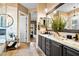 Bathroom with dark brown cabinets, granite countertops and marble shower at 40903 N Harbour Town Way, Anthem, AZ 85086