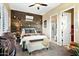 Bedroom with rustic western decor and ensuite bathroom at 40903 N Harbour Town Way, Anthem, AZ 85086