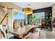 Elegant dining room with a live-edge wood table and access to the backyard at 40903 N Harbour Town Way, Anthem, AZ 85086