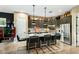 Modern kitchen with dark cabinetry, marble countertops, and a large island at 40903 N Harbour Town Way, Anthem, AZ 85086