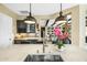 Gourmet kitchen featuring a marble island, pendant lighting, stainless steel sink, and modern fixtures at 40903 N Harbour Town Way, Anthem, AZ 85086